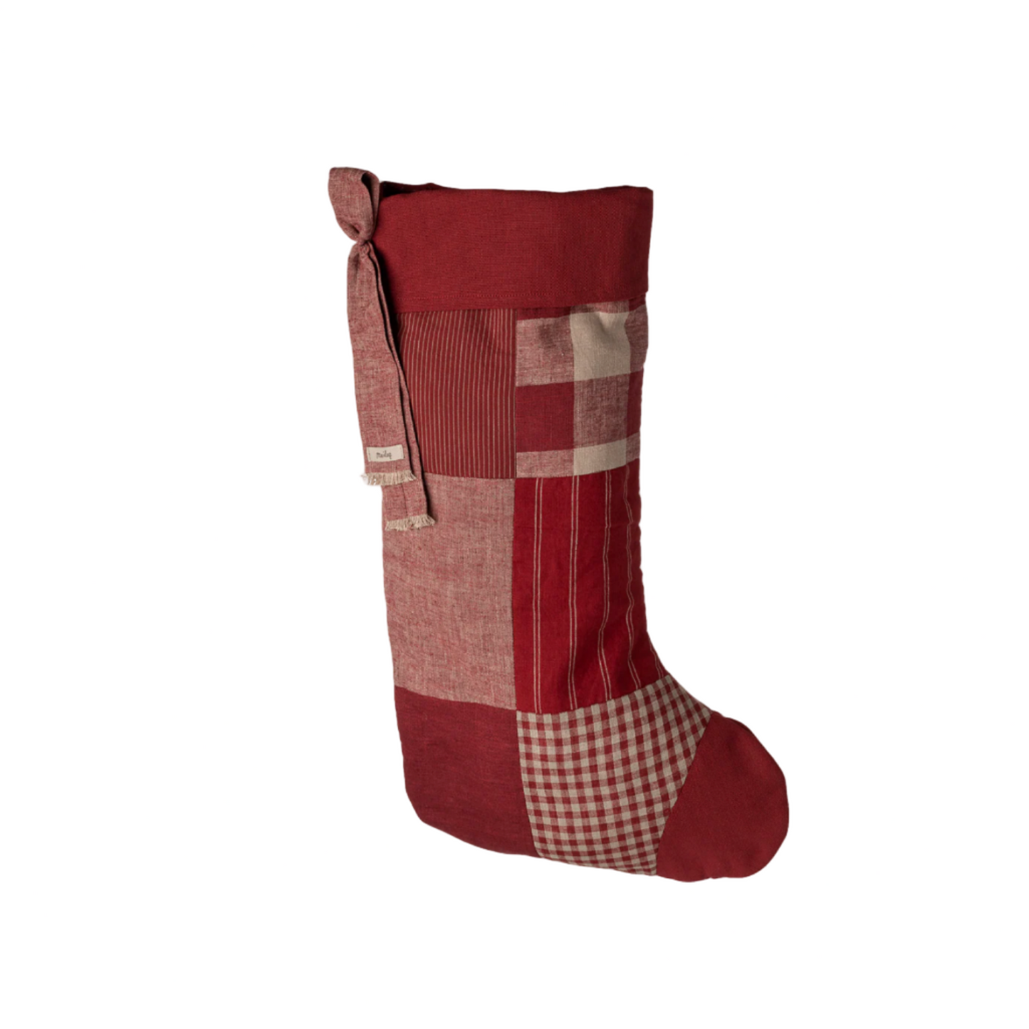 Red and checkered Christmas stocking on a white background