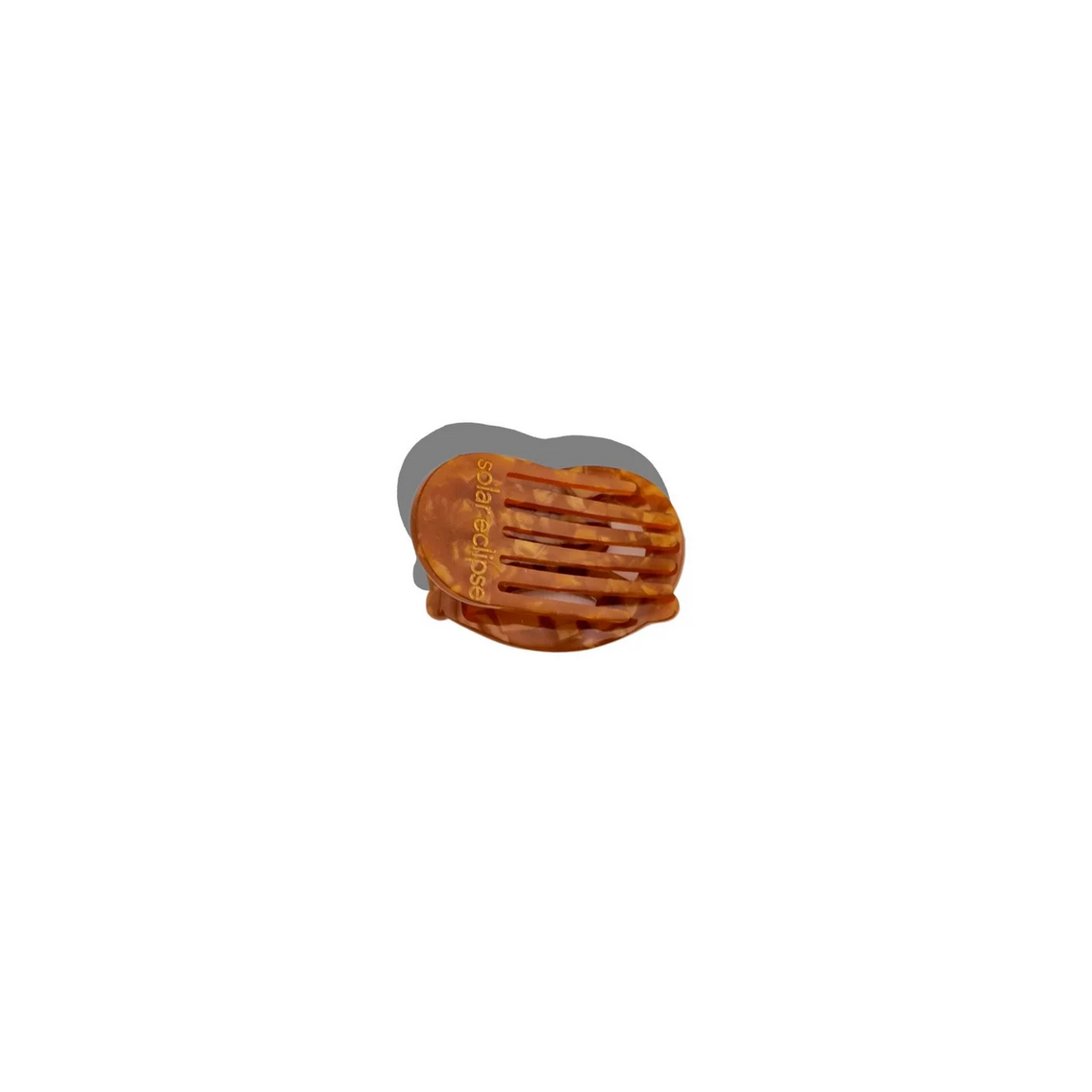 Small brown and gray object on a white background
