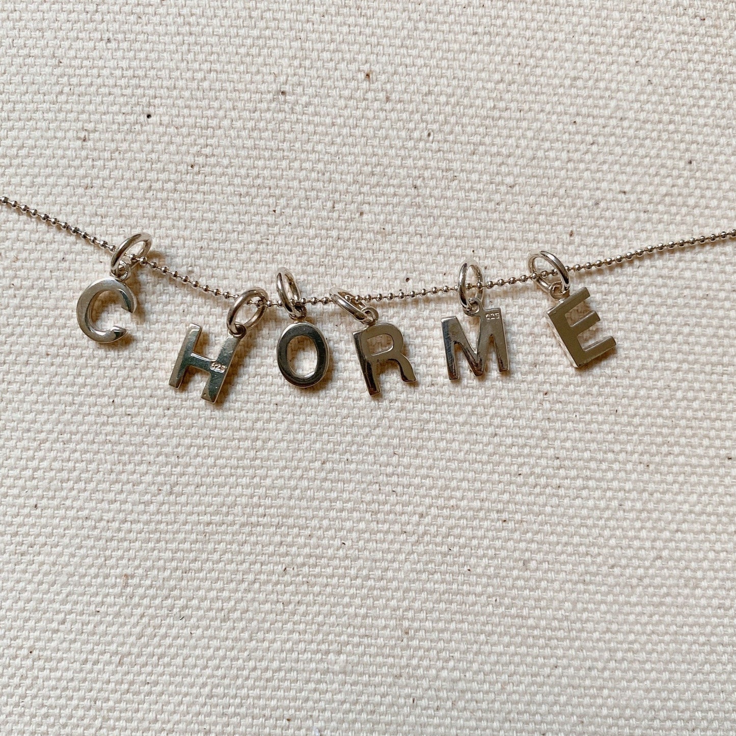SILVER INITIAL CHARM