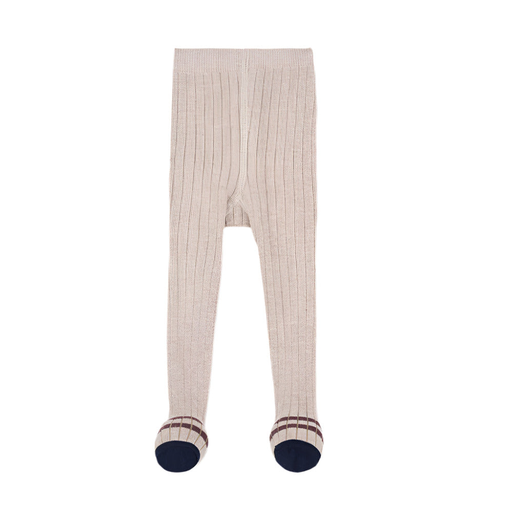 Beige ribbed tights with navy cuffs on a white background