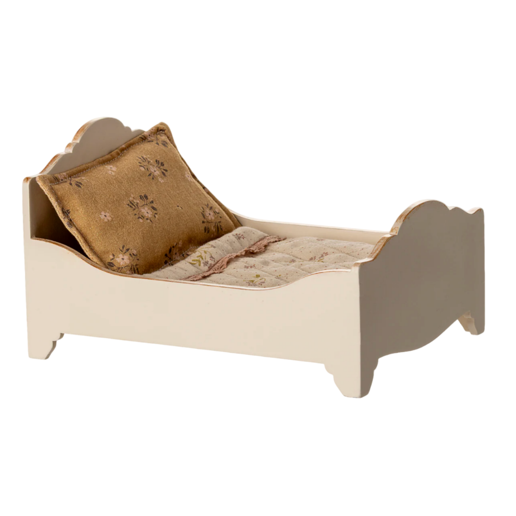 Small bed with a pillow on a white background