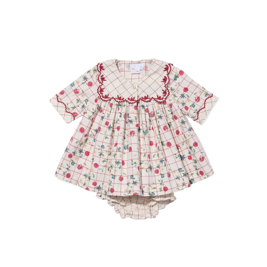 Children's dress with floral and checkered pattern on a white background